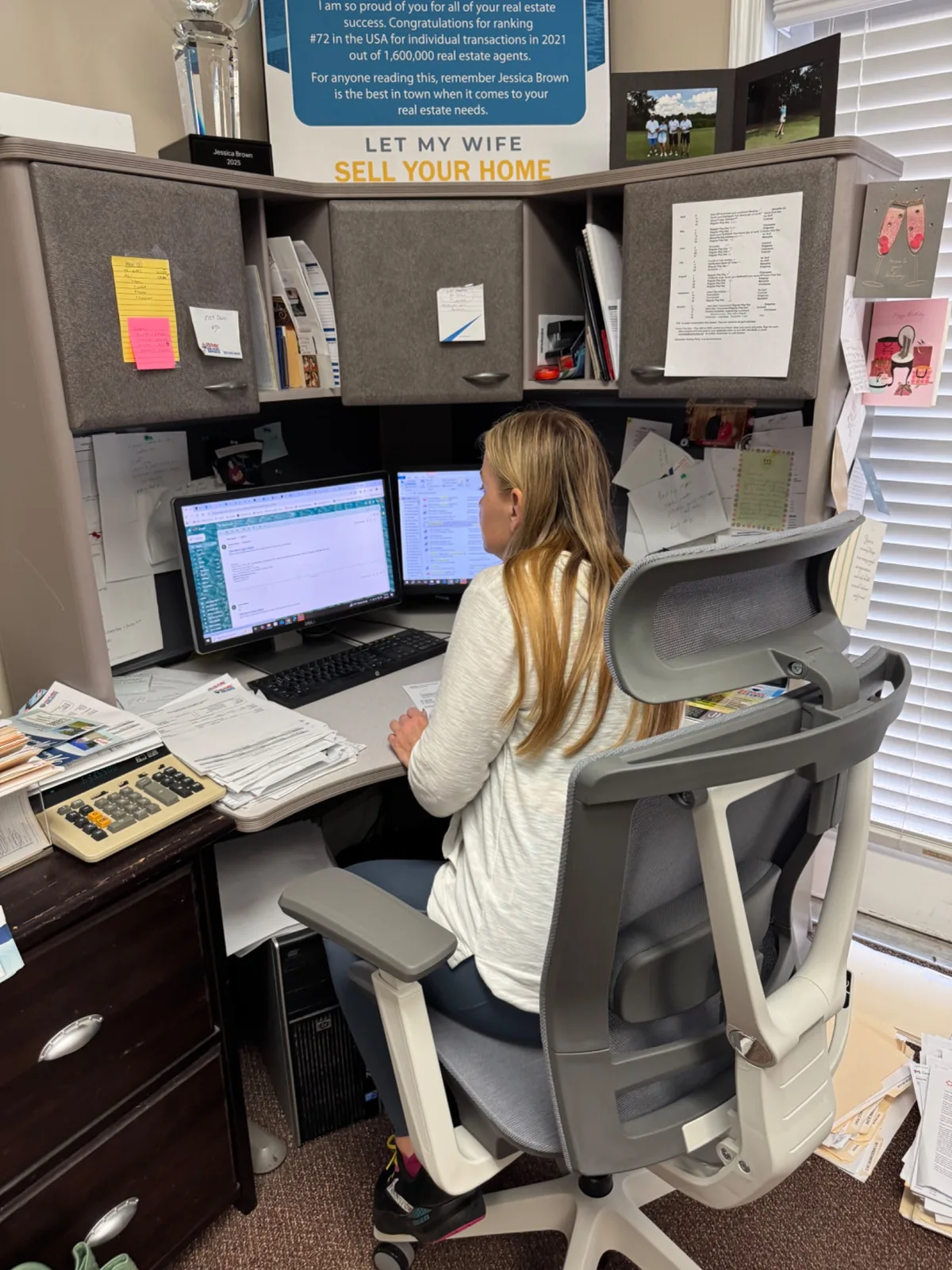 Jessica Brown working at her desk for Memphis and North Mississippi real estate clients